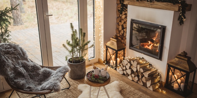 Wood burning fireplace with a stack of wood in living room